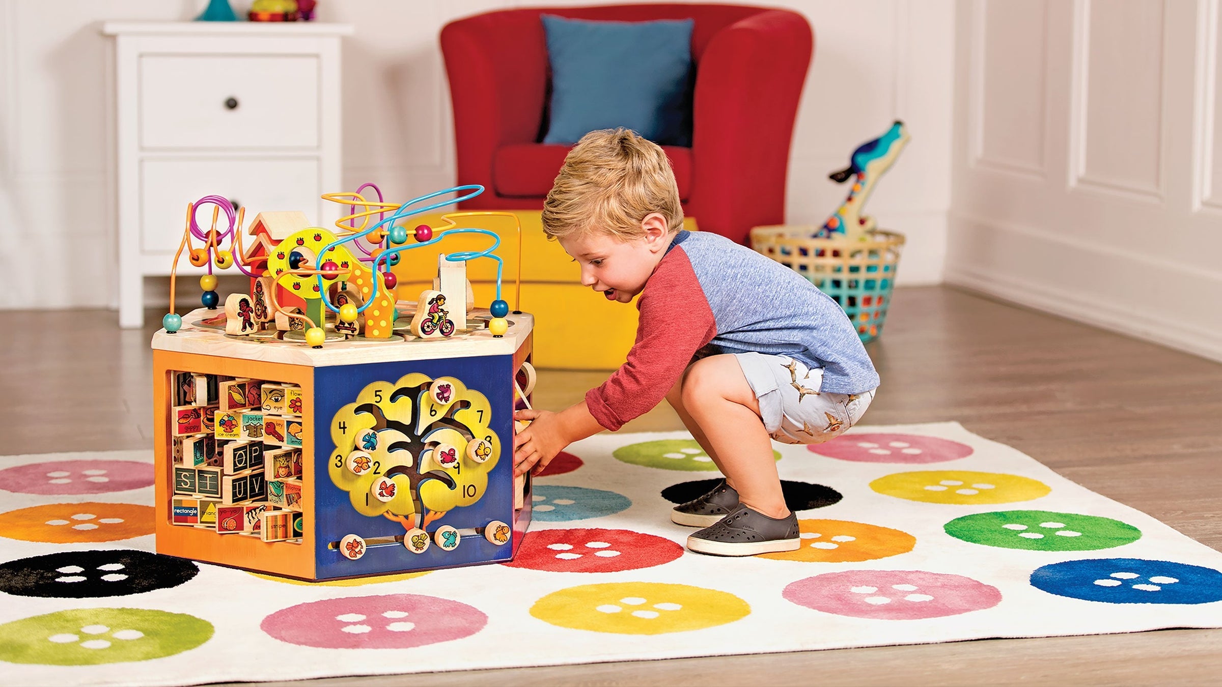 Kid playing with B. Wooden Activity Cube Zany Zoo